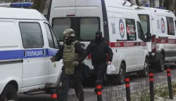 epa12595827 Russian policemen guard near the entrance of the Uspenskaya School in the Odintsovo District of the Moscow Region, Russia, 16 December 2025. A 10-year-old schoolboy died of his injuries after a teenager armed with a knife attacked security guards and his schoolmates at a school outside Moscow, the Investigative Committee said. The attacker was detained and taken to the investigating authorities. EPA/MAXIM SHIPENKOV