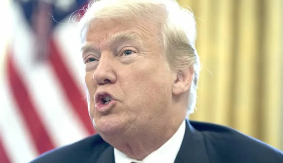 epa06403178 US President Donald J. Trump delivers remarks to members of the news media while signing a series of bills in the Oval Office of the White House in Washington, DC, USA, 22 December 2017. Trump signed the tax bill, a continuing resolution to fund the government, and a missile defense bill before leaving to spend Christmas in Mar-a-Lago, Florida. EPA/MICHAEL REYNOLDS