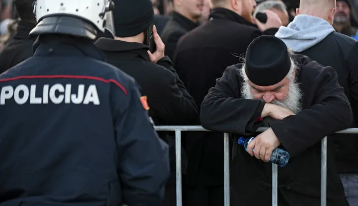 epa08090972 Serbian Orthodox Church in Montenegro monk takes part in a protest rally in Podgorica, Montenegro, 26 December 2019. Members of the Serbian Orthodox Church in Montenegro are protesting against a controversial new law on religion, which the church has called a plot to strip it of its property. Montenegro's government proposed a new bill on religion requiring all religious communities, including Catholic and Orthodox churches, to register their immovable assets as state property. The law also states that religious communities can only retain their assets if they can produce evidence of the right to ownership, triggering allegations from the Serbian Church that the government plans to dispute its holdings. EPA/BORIS PEJOVIC EPA-EFE/BORIS PEJOVIC