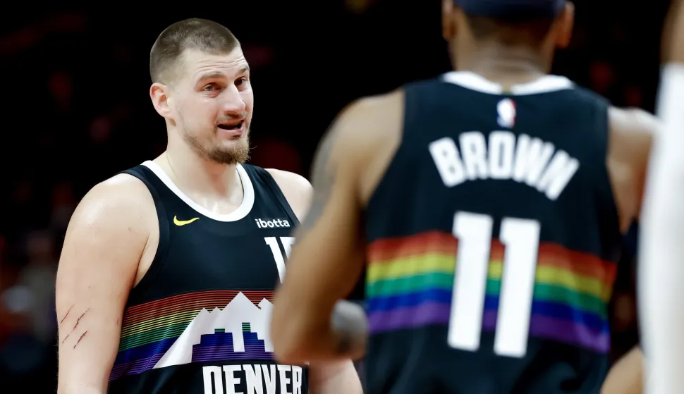 epa12573487 Denver Nuggets center Nikola Jokic (L) reacts with Nuggets guard Bruce Brown (R) during the second half of an NBA basketball game between the Denver Nuggets and the Atlanta Hawks in Atlanta, Georgia, USA, 05 December 2025. EPA/ERIK S. LESSER SHUTTERSTOCK OUT