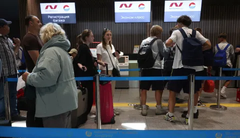 epa12242992 Passengers of Russian Nordwind Airlines queue in front of check-in desks at Sheremetyevo International Airport outside Moscow, Russia, 17 July 2025. According to the Russian Ministry of Transport, Nordwind Airlines will begin operating direct flights between Moscow and Pyongyang, North Korea on 27 July 2025. EPA/MAXIM SHIPENKOV