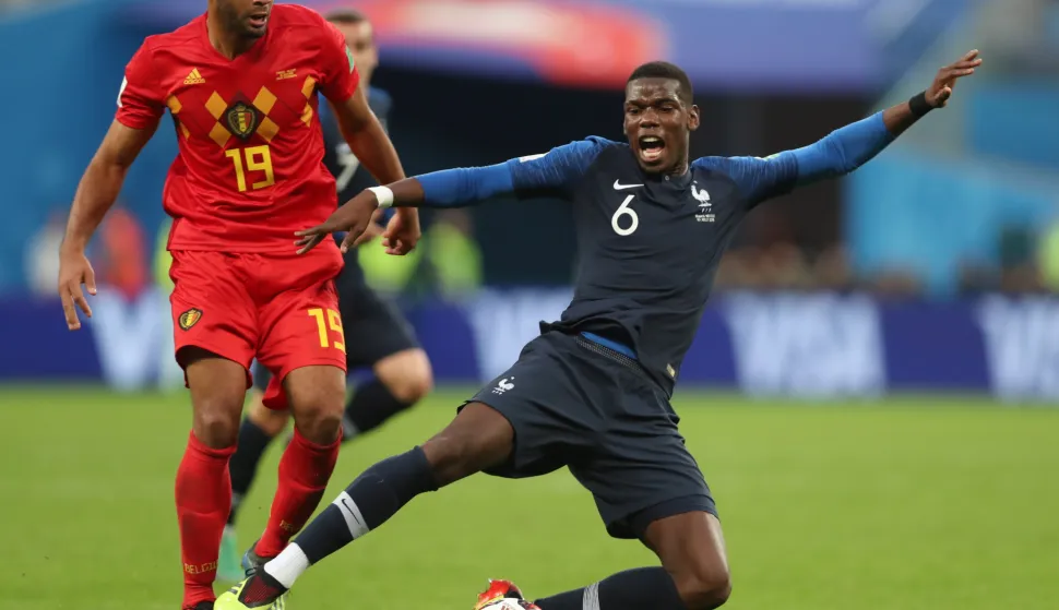 epa06878834 Moussa Dembele (L) of Belgium and Paul Pogba of France in action during the FIFA World Cup 2018 semi final soccer match between France and Belgium in St.Petersburg, Russia, 10 July 2018.(RESTRICTIONS APPLY: Editorial Use Only, not used in association with any commercial entity - Images must not be used in any form of alert service or push service of any kind including via mobile alert services, downloads to mobile devices or MMS messaging - Images must appear as still images and must not emulate match action video footage - No alteration is made to, and no text or image is superimposed over, any published image which: (a) intentionally obscures or removes a sponsor identification image; or (b) adds or overlays the commercial identification of any third party which is not officially associated with the FIFA World Cup) EPA/TOLGA BOZOGLU  EDITORIAL USE ONLY