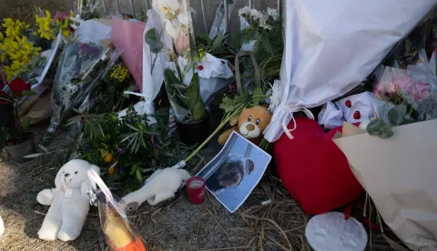 Photographs, plush toys and flowers displayed on barriers at the entrance of "La Madrague" house, property of late Brigitte Bardot in Saint-Tropez, southeastern France on December 29, 2025. French film legend Brigitte Bardot died at 91 AFP learnt from Bardot foundation on December 28, 2025. (Photo by MIGUEL MEDINA/AFP)