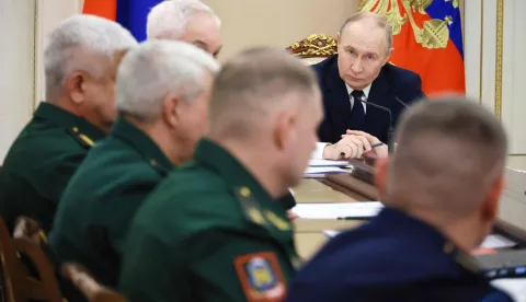 In this pool photograph distributed by the Russian state agency Sputnik, Russia's President Vladimir Putin chairs a meeting on situation in the zone of the "special military operation", the Kremlin's term for the nearly four-year-long Ukraine offensive, in Moscow on December 29, 2025. (Photo by Mikhail METZEL/POOL/AFP)