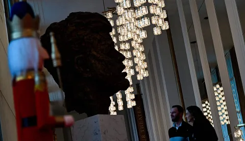 People visit the John F. Kennedy Center for the Performing Arts, which was recently renamed the "Trump Kennedy Center," in Washington, DC, on December 26, 2025. US President Donald Trump's name was affixed to the Kennedy Center in Washington on December 19, 2025, one day after his hand-picked board members voted to rename the arts venue in spite of legal questions. (Photo by Brendan Smialowski/AFP)