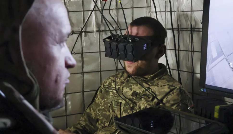 epa12440289 A handout picture made available by the press service of the 65th Separate Mechanised Brigade of Ukrainian Armed Forces shows the pilot of an air defense crew controls an interceptor drone from their position in the Zaporizhzhia region, Ukraine, 08 October 2025, amid the ongoing Russian invasion. Ukrainian interceptor drones work against different Russian drones the such as reconnaissance drones, FPV, and others, which are the main threat to military and civilians on the territory close to the frontline. EPA/Press service of the 65th Mechanized Brigade/HANDOUT HANDOUT EDITORIAL USE ONLY/NO SALES