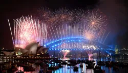 Fireworks light up the midnight sky over Sydney Harbour Bridge and Sydney Opera House during New Year?s Day celebrations in Sydney on January 1, 2026. (Photo by Saeed KHAN/AFP)