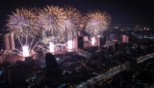 Fireworks light up the midnight sky over the Chao Phraya River during 2026 New Year's Day celebrations in Bangkok on January 1, 2026. (Photo by Chanakarn Laosarakham/AFP)