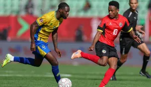 Gabon's defender #04 Alex Moucketou-Moussounda and Mozambique's midfielder #10 Geny Catamo vie during the Africa Cup of Nations (CAN) Group F football match between Gabon and Mozambique at Grand Stadium in Agadir on December 28, 2025. (Photo by FRANCK FIFE/AFP)