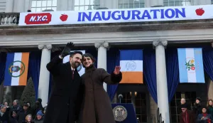 New York mayor Zohran Mamdani and his wife Rama Duwaji wave during his public inauguration ceremony followed by a block party at City Hall in New York on January 1, 2026. Mamdani, the young upstart of the US left, was sworn in Thursday to take over as New York mayor for a term sure to see him cross swords with President Donald Trump. After the clocks struck midnight, bringing in 2026, Mamdani took his oath of office at an abandoned subway stop to begin managing the United States' largest city. He is New York's first Muslim mayor. (Photo by TIMOTHY A. CLARY/AFP)