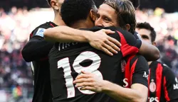 AC Milan's French forward #18 Christopher Nkunku (L) celebrates with AC Milan's Croatian midfielder #14 Luka Modric (R) after scoring his team second goal during the Italian Serie A football match between AC Milan and Hellas Verona at the San Siro stadium in Milan, northern Italy, on December 28, 2025. (Photo by Piero CRUCIATTI/AFP)