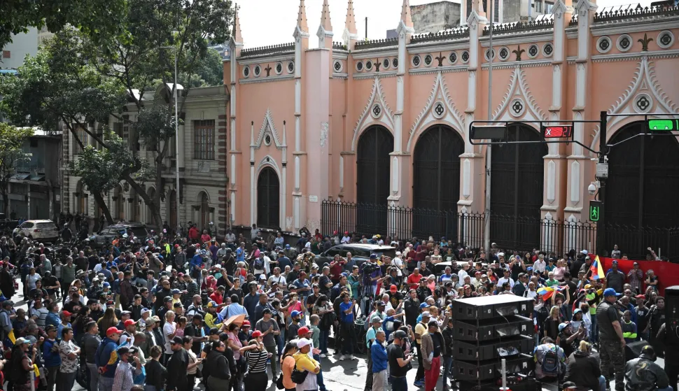 Supporters of Venezuela's President Nicolas Maduro gather in the streets of Caracas on January 3, 2026, after US forces captured him. President Donald Trump said Saturday that US forces had captured Venezuela's leader Nicolas Maduro after bombing the capital Caracas and other cities in a dramatic climax to a months-long standoff between Trump and his Venezuelan arch-foe. (Photo by Federico PARRA/AFP)