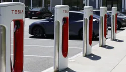 epa11340712 A Tesla Supercharger charging station on the edge of a car park in Littleton, Massachusetts, USA, 14 May 2024. US President Joe Biden announced that the United States will impose new tariffs of 18 billion USD on a variety of imported Chinese products including steel and aluminum, computer parts, and solar cells. EPA/CJ GUNTHER