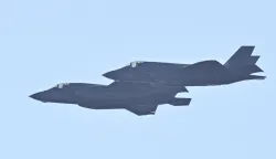 US military fighter jets fly over at Jos? Aponte de la Torre Airport, formerly Roosevelt Roads Naval Station, in Ceiba, Puerto Rico, on January 3, 2026. President Donald Trump said Saturday that US forces had captured Venezuelan leader Nicolas Maduro after launching a "large scale strike" on the South American country. "The United States of America has successfully carried out a large scale strike against Venezuela and its leader, President Nicolas Maduro, who has been, along with his wife, captured and flown out of the Country," Trump said on Truth Social. (Photo by Miguel J. Rodriguez Carrillo/AFP)