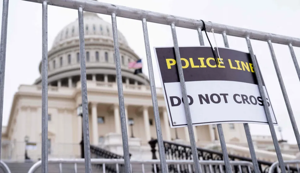 A police sign hangs outside the US Capitol in Washington, DC, January 5, 2026, one day before the 5 year anniversary of the January 6, 2021 attack on the US Capitol during the certification of the 2020 US presidential election. (Photo by SAUL LOEB/AFP)
