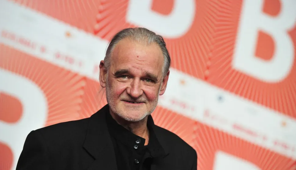 (FILES) Hungarian director Bela Tarr poses at a press conference after receiving a silver bear in the "JURY GRAND PRIX" for his movie "The Turin Horse" (A torin?i l?) after the awards ceremony of the international Berlinale film festival on February 19, 2011 in Berlin. Legendary Hungarian filmmaker Bela Tarr died on January 6, 2026 at the age of 70, director Bence Fliegauf informed national news agency MTI on behalf of the family. Tarr was best known for the best known for directing the movie "Satantango" (1994), a seven-hour epic about the collapse of communism in Eastern Europe and its material and spiritual decline, adapted from the novel by Nobel laureate Laszlo Krasznahorkai, whom he frequently collaborated with. (Photo by John MACDOUGALL/AFP)