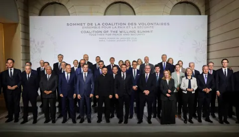 (Front row from L) Cyprus's Minister of Energy, Commerce and Industry Michael Damaianos, NATO Secretary General Mark Rutte, Canada's Prime Minister Mark Carney, European Council President Antonio Costa, Poland's Prime Minister Donald Tusk, Slovenia's Prime Minister Robert Golob, Ukraine's President Volodymyr Zelensky, France's President Emmanuel Macron, Britain's Prime Minister Keir Starmer, Italy's Prime Minister Giorgia Meloni, European Commission President Ursula Von der Leyen,US Special Envoy Steve Witkoff, US President's son-in-law and businessman Jared Kushner and US Ambassador to France Charles Kushner (back row) Croatia's Prime Minister Andrej Plenkovic, Albania's Prime Minister Edi Rama, Spain's Prime Minister Pedro Sanchez, Sweden's Prime Minister Ulf Kristersson, Finland's President Alexander Stubb, Romania's President Nicusor Dan, Denmark's Prime Minister Mette Frederiksen and Belgium's Prime Minister Bart De Wever pose for a family photo at the Elysee Palace in Paris, on January 6, 2026, on the sideline of the Coalition of the Willing summit on security guarantees for Ukraine. The summit of the group of Ukraine supporters dubbed the "Coalition of the Willing" is the latest of several meetings planned for the new year as diplomatic efforts to end Europe's deadliest conflict since World War II have gained pace in recent weeks. (Photo by Ludovic MARIN/POOL/AFP)