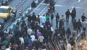 Shopkeepers and traders protest in the street against the economic conditions and Iran's embattled currency in Tehran on December 29, 2025. Some shopkeepers in Tehran closed their stores on December 29 in protest against economic hardships and sharp swings in Iran's embattled currency, Iranian media reported, following similar demonstrations a day earlier. Iran's currency has hit new lows on the unofficial market, with the US dollar trading at around 1.42 million rials on Sunday, compared to 820,000 rials a year ago and the euro nearing 1.7 million rials, according to price monitoring websites. (Photo by HANDOUT/FARS NEWS AGENCY/AFP)