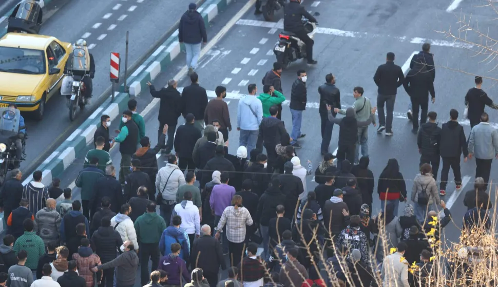 Shopkeepers and traders protest in the street against the economic conditions and Iran's embattled currency in Tehran on December 29, 2025. Some shopkeepers in Tehran closed their stores on December 29 in protest against economic hardships and sharp swings in Iran's embattled currency, Iranian media reported, following similar demonstrations a day earlier. Iran's currency has hit new lows on the unofficial market, with the US dollar trading at around 1.42 million rials on Sunday, compared to 820,000 rials a year ago and the euro nearing 1.7 million rials, according to price monitoring websites. (Photo by HANDOUT/FARS NEWS AGENCY/AFP)