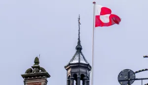 The Greenlandic flag (Erfalasorput) flies on the roof of Tivoli Castle in Copenhagen, on January 8, 2026. US President Donald Trump is discussing options including military action to take control of Greenland, the White House said on January 6, 2025, upping tensions that Denmark warns could destroy the NATO alliance. Trump has stepped up his designs on the mineral-rich, self-governing Danish territory in the arctic since the US military seized Venezuelan leader Nicolas Maduro on January 3, 2026. (Photo by Ida Marie Odgaard/Ritzau Scanpix/AFP)/Denmark OUT