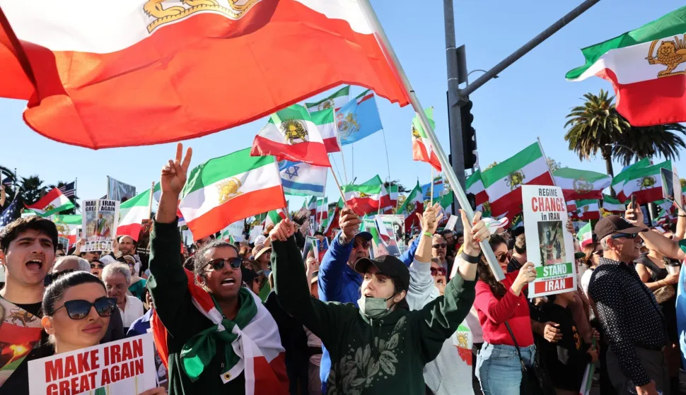 Activists take part in a ?Free Iran? rally in Los Angeles, California, on January 11, 2026. The Norway-based NGO Iran Human Rights (IHR) said it had confirmed the killing of at least 192 protesters but warned the actual death toll could already amount to several hundreds, or even more. The IHR has an extensive network of sources in the country. The protests, initially sparked by anger over the rising cost of living, have evolved into a movement against the theocratic system in place in Iran since the 1979 revolution. They have already lasted two weeks. (Photo by Jonathan Alcorn/AFP)