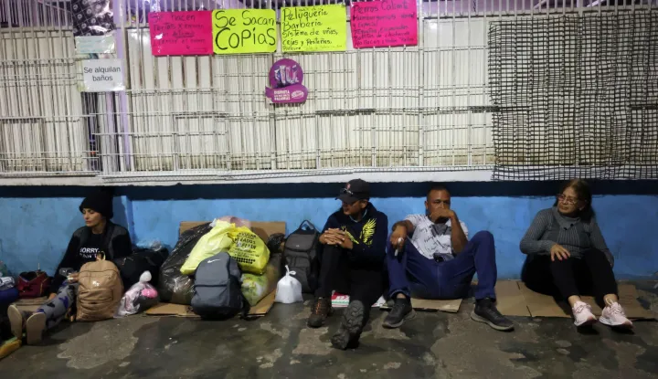 Relatives of political prisoners wait outside El Rodeo I prison in Guatire, Miranda State, some 30 kilometers east of Caracas on January 11, 2026. Venezuelans waited on January 11 for more political prisoners to be freed as ousted president Nicolas Maduro defiantly claimed from his US jail cell that he was "doing well" after being seized by US forces a week ago. (Photo by Pedro MATTEY/AFP)