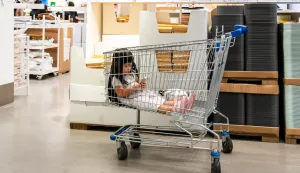 A view of a child sitting in a shopping cart and watching a smartphone at IKEA Bangna in Bangkok. IKEA, the global leader in affordable minimalist furniture, expanded across Asia from the 1970s but entered Thailand much later, in 2011. Its restaurants, play areas, seasonal promotions, and strong social-media presence have made it a popular weekend spot for families and young consumers, mainly attracting middle- to upper-middle-class customers who value modern design and style, as the brand is not the cheapest option compared with local furniture shops. (Photo by Nathalie Jamois/SOPA Images/Sipa USA) Photo: SOPA Images/SIPA USA