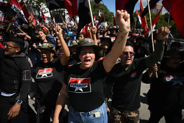 Members of the Marxist-Leninist and far-left political party (Tupamaro) attend a march in Caracas on January 9, 2026, to demand the release of deposed Venezuelan president Nicolas Maduro and his wife Cilia Flores, snatched and taken to New York on January 3 to face trial on drug and weapons charges. Colombia's President Gustavo Petro on January 9. urged Venezuela to jointly fight drug-traffickers operating across the two countries' border, after the United States threatened further armed action in the region. (Photo by Federico PARRA/AFP)