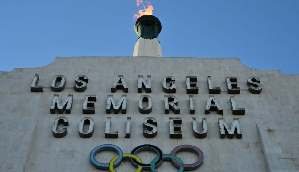 The LA28 Olympic cauldron is lit during a ceremonial lighting at the Memorial Coliseum in Los Angeles on January 13, 2026, ahead of the launch of ticket registration for the 2028 Summer Olympic Games. (Photo by Frederic J. Brown/AFP)