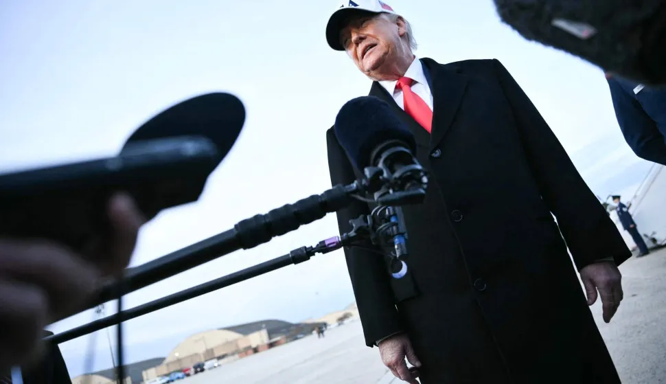 US President Donald Trump speaks to the press upon returning to Joint Base Andrews in Maryland on January 13, 2026. Trump is returning from speaking to The Detroit Economic Club in Detroit, Michigan, and a visit to a Ford production plant. (Photo by Mandel NGAN/AFP)