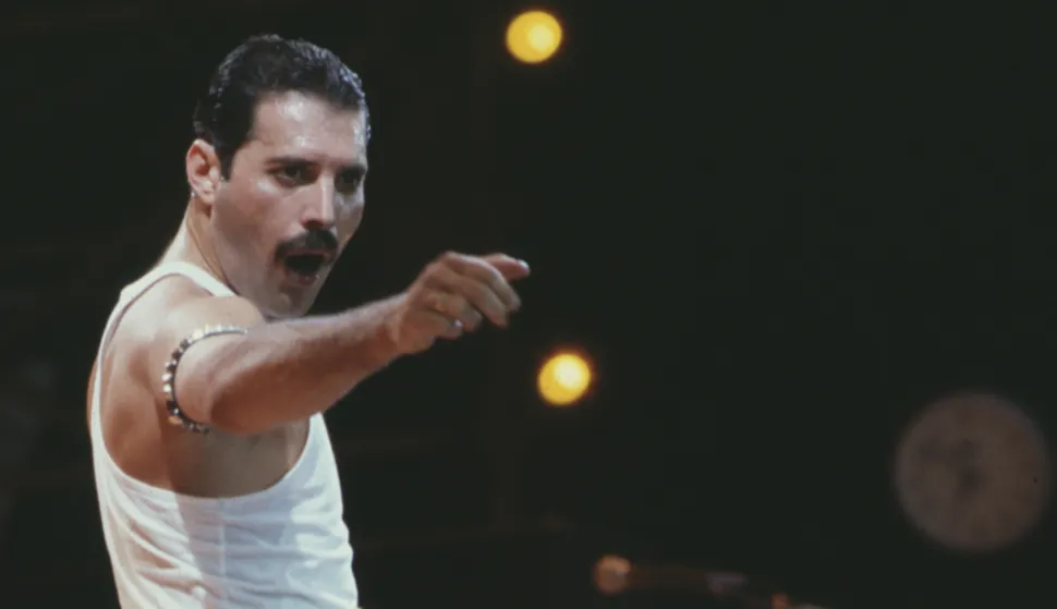 File photo dated 13/7/1985 of Freddie Mercury, of the pop band Queen, performing on stage during the Live Aid concert. British rock legends Queen have made history by becoming the first album to surpass seven million UK chart sales. The record was broken by Queen's Greatest Hits album, recorded in 1981, which includes classic tracks such as We Will Rock You, Don't Stop Me Now and Bohemian Rhapsody. Issue date: Tuesday July 19, 2022. Photo: PA/PRESS ASSOCIATION