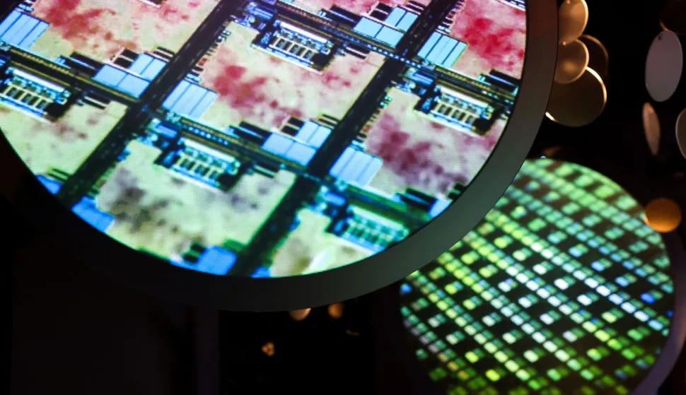 (FILES) An image of an electronic wafer is displayed at the Taiwan Semiconductor Manufacturing Company (TSMC) Museum of Innovation in Hsinchu on November 21, 2024. Taiwan said on January 16, 2026 it will remain the world's "most important" producer of AI semiconductor chips, after reaching a trade deal with the United States that will see Taiwanese companies increase investment on US soil. (Photo by I-Hwa CHENG/AFP)