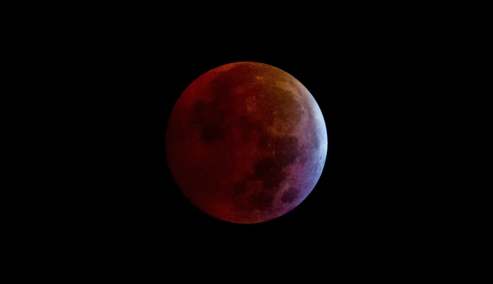 epa11963075 The so-called 'Blood Worm Moon' during a total lunar eclipse as seen from Caracas, Venezuela, early 14 March 2025. According to the US National Weather Service (NWS), a total lunar eclipse occurs when the entire moon passes into the Earth's umbral shadow. EPA/MIGUEL GUTIERREZ