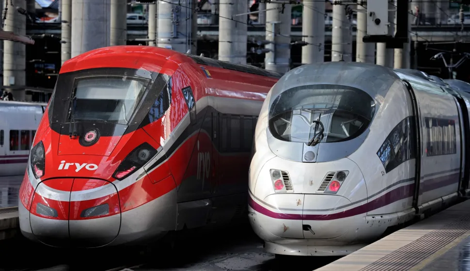 (FILES) High-speed train AVE of the Spanish national railways company RENFE (R) is seen next to high-speed train of private operator Iryo of ILSA company at the Atocha station in Madrid, on February 26, 2023. At least five people have been killed after a train derailed on January 18, 2026 in the southern Spanish province of Cordoba following a collision with another train, a police spokesman told AFP. (Photo by Thomas COEX/AFP)
