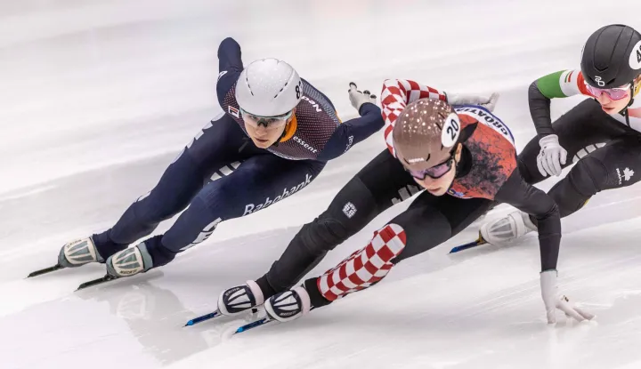 Dutch speed skater Selma Poutsma (L) and Georgian speed skater Valentina Asenc (C) compete in the 1000m quarterfinals on the second day of the European Short Track Speed Skating Championships in Tilburg on January 17, 2026. (Photo by Iris van den Broek/ANP/AFP)/Netherlands OUT