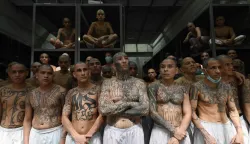 AFP PICTURES OF THE YEAR 2025Inmates remain in a cell at the Counter-Terrorism Confinement Centre (CECOT) mega-prison, where hundreds of members of the MS-13 and 18 Street gangs are being held, in Tecoluca, El Salvador on January 27, 2025.. The CECOT, the largest prison in Latin America and emblem of the war against gangs of the government of President Nayib Bukele, celebrates two years since it was inaugurated on February 1. (Photo by Marvin RECINOS/AFP)/AFP PICTURES OF THE YEAR 2025