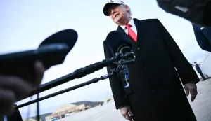 US President Donald Trump speaks to the press upon returning to Joint Base Andrews in Maryland on January 13, 2026. Trump is returning from speaking to The Detroit Economic Club in Detroit, Michigan, and a visit to a Ford production plant. (Photo by Mandel NGAN/AFP)