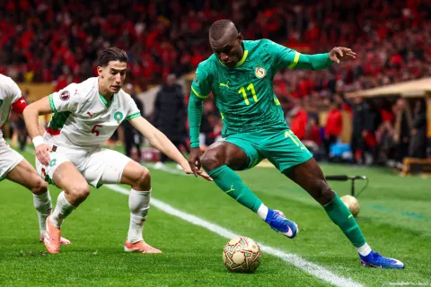 Senegal's forward #11 Nicolas Jackson and Morocco's defender #05 Nayef Aguerd fight for the ball during the Africa Cup of Nations (CAN) final football match between Senegal and Morocco at the Prince Moulay Abdellah Stadium in Rabat on January 18, 2026. (Photo by FRANCK FIFE/AFP)