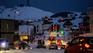 Traffic drives down a street in Nuuk, Greenland, on January 19, 2026. (Photo by Mads Claus Rasmussen/Ritzau Scanpix/AFP)/Denmark OUT