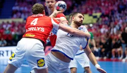Portugal's Martim Costa shoots next to Denmark's Magnus Landin (L) and Simon Hald during the EHF Euro 2026 Group B preliminary round handball match between Denmark and Portugal in Herning on January 20, 2026. (Photo by Bo Amstrup/Ritzau Scanpix/AFP)/Denmark OUT