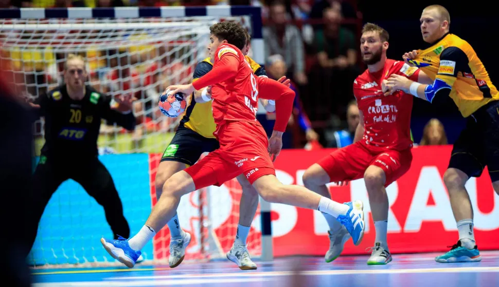 Croatia's right back #09 Luka Klarica plays the ball during the men's EHF Euro 2026 Group E preliminary round handball match between Sweden and Croatia in Malmo, Sweden, on January 21, 2026. (Photo by Andreas Hillergren/TT/TT News Agency/AFP)/Sweden OUT