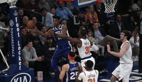 epa07280774 Philadelphia 76ers guard Jimmy Butler (L) is forced to pass by New York Knicks forward Noah Vonleh (C) in the first half of the NBA basketball game between the Philadelphia 76ers and the New York Knicks at Madison Square Garden in New York, New York, USA, 13 January 2019. EPA/PETER FOLEY SHUTTERSTOCK OUT