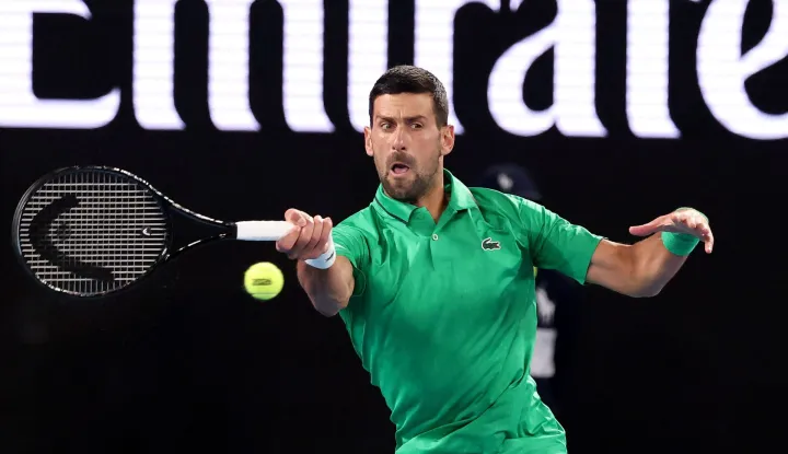 Serbia's Novak Djokovic hits a return to Spain?s Pedro Martinez during their men's singles match on day two of the Australian Open tennis tournament in Melbourne on January 19, 2026. (Photo by DAVID GRAY/AFP)/-- IMAGE RESTRICTED TO EDITORIAL USE - STRICTLY NO COMMERCIAL USE --