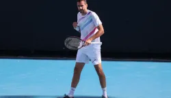 Croatia?s Marin Cilic reacts after a point against Canada's Denis Shapovalov during their men's singles match on day five of the Australian Open tennis tournament in Melbourne on January 22, 2026. (Photo by IZHAR KHAN/AFP)/-- IMAGE RESTRICTED TO EDITORIAL USE - STRICTLY NO COMMERCIAL USE --