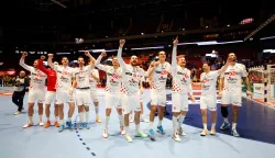 Croatia's team celebrates the victory over Iceland during the men's EHF Euro 2026 main round handball match Iceland v Croatia in Malmoe, Sweden, on January 23, 2026. (Photo by Andreas Hillergren/TT/various sources/AFP)/Sweden OUT