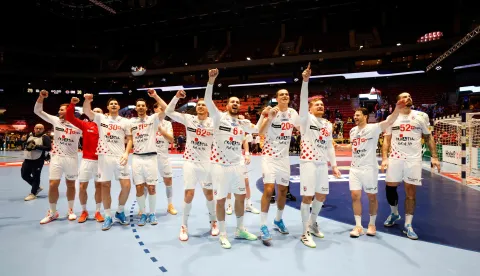 Croatia's team celebrates the victory over Iceland during the men's EHF Euro 2026 main round handball match Iceland v Croatia in Malmoe, Sweden, on January 23, 2026. (Photo by Andreas Hillergren/TT/various sources/AFP)/Sweden OUT