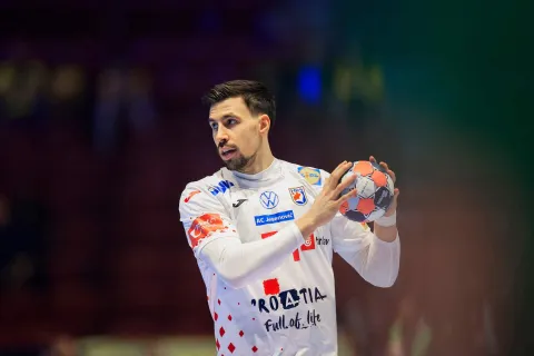 Croatia's right back #51 Ivan Martinovic plays the ball during the men's EHF Euro 2026 main round handball match Iceland v Croatia in Malmoe, Sweden, on January 23, 2026. (Photo by Andreas Hillergren/TT/TT NEWS AGENCY/AFP)/Sweden OUT