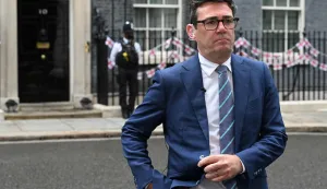 (FILES) Greater Manchester mayor Andy Burnham speaks to the press after the first roundtable meeting with regional English mayors outside 10 Downing Street in London on July 9, 2024. Andy Burnham has announced that he intends to stand in the Gorton and Denton by-election, setting up a potential return to Westminster for the Greater Manchester mayor. (Photo by JUSTIN TALLIS/AFP)