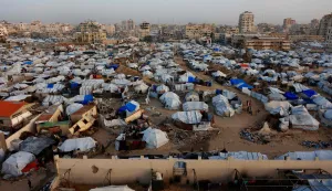 EDITORS NOTE: Graphic content/Tents housing displaced Palestinians are erected on empty land near buildings destroyed by the Israeli military, in Gaza City on January 24, 2026. The majority of Gaza's 2.4 million people have been displaced, often multiple tim es, by the war that began with Hamas's attack on southern Israel on October 7, 2023. With displaced families living in tented camps, a serious concerns has been raised over their living conditions. (Photo by Omar AL-QATTAA/AFP)