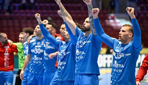 (R-L) Croatia's wing #39 David Mandic, Croatia's wing #62 Marin Jelinic, Croatia's right back #51 Ivan Martinovic, Croatia's left back #11 Zvonimir Srna, Croatia's left back #30 Marko Mamic celebrate the victory over Switzerland the after the men's EHF Euro 2026 main round handball match Switzerland v Croatia in Malmo, Sweden, on January 25, 2026. (Photo by Johan Nilsson/TT/TT News Agency/AFP)/Sweden OUT